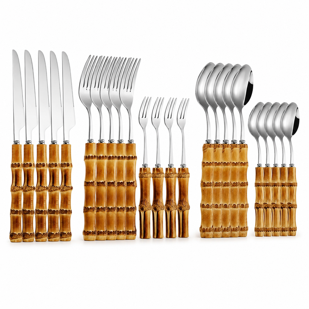 Set of silver cutlery with bamboo handles on a white background
