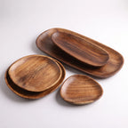 5-Piece Wooden serving Set  For charcuterie and food in a white studio. 