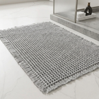 Gray textured rug on a light wooden floor