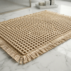 Beige woven mat with tassels on a marble floor