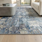 Patterned area rug in a living room setting with a sofa and coffee table.