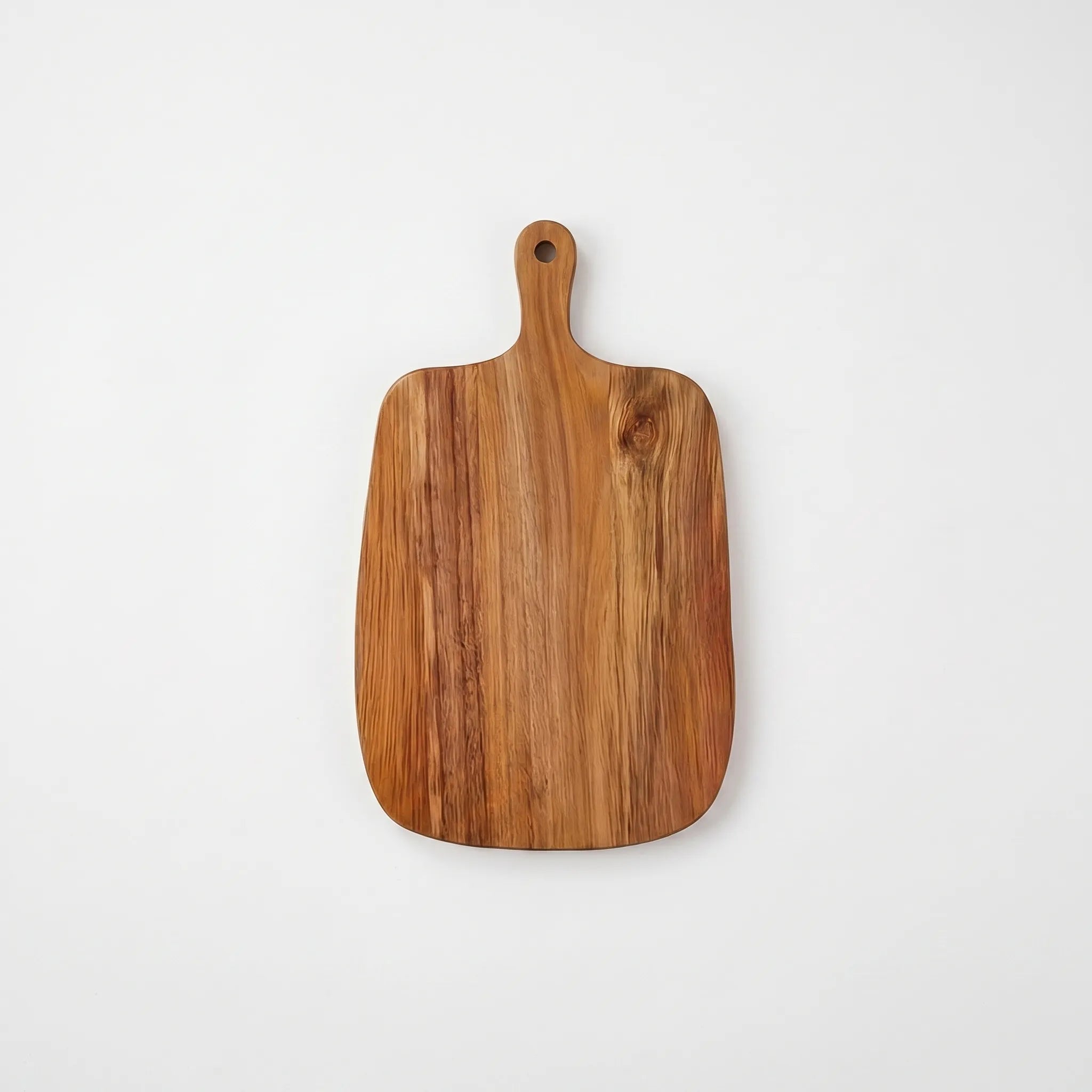 Wooden cutting board with a handle on a white background