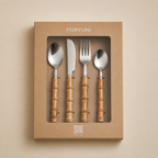 Set of cutlery with wooden handles in a FORYUNI box on a beige background