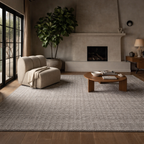 Modern living room with a beige armchair, coffee table, and fireplace.