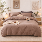 Bedroom with brown bedding and decorative elements