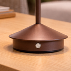 Brown lamp base on a wooden surface