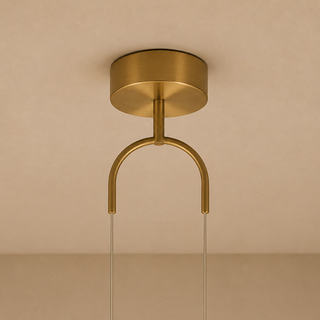 Gold ceiling light fixture on a beige background