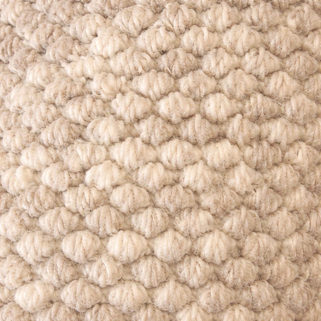 Close-up of textured beige carpet