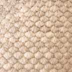 Close-up of textured beige carpet