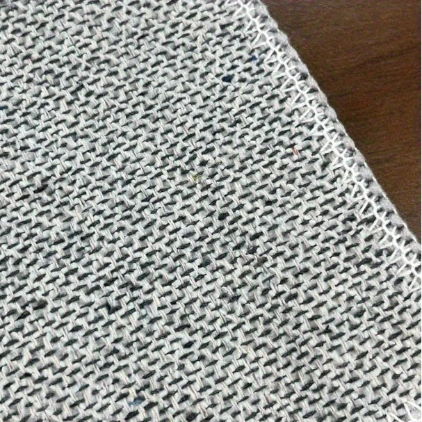 Textile with anti-slip backing on a wooden surface