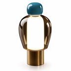 Modern table lamp with a blue top and gold base on a white background