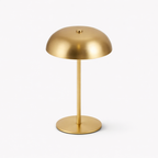 Gold table lamp on a white background