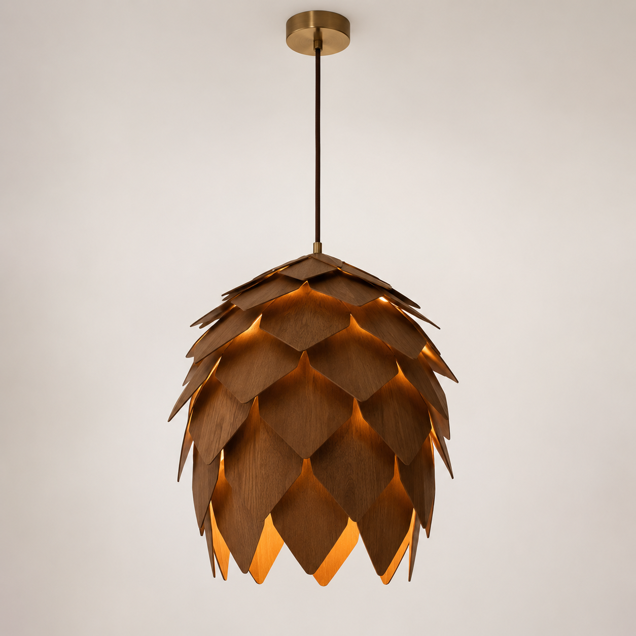 Wooden pendant light with a unique pinecone lamp design on a plain background