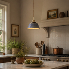 Cozy kitchen with marble island, pendant light, and decorative elements.