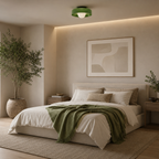 Modern bedroom with a bed, green blanket, a nice green ceiling lamp and abstract art on the wall.