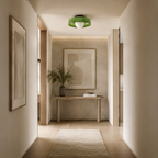 Modern hallway with a wooden console table, framed artwork, and a green ceiling light.