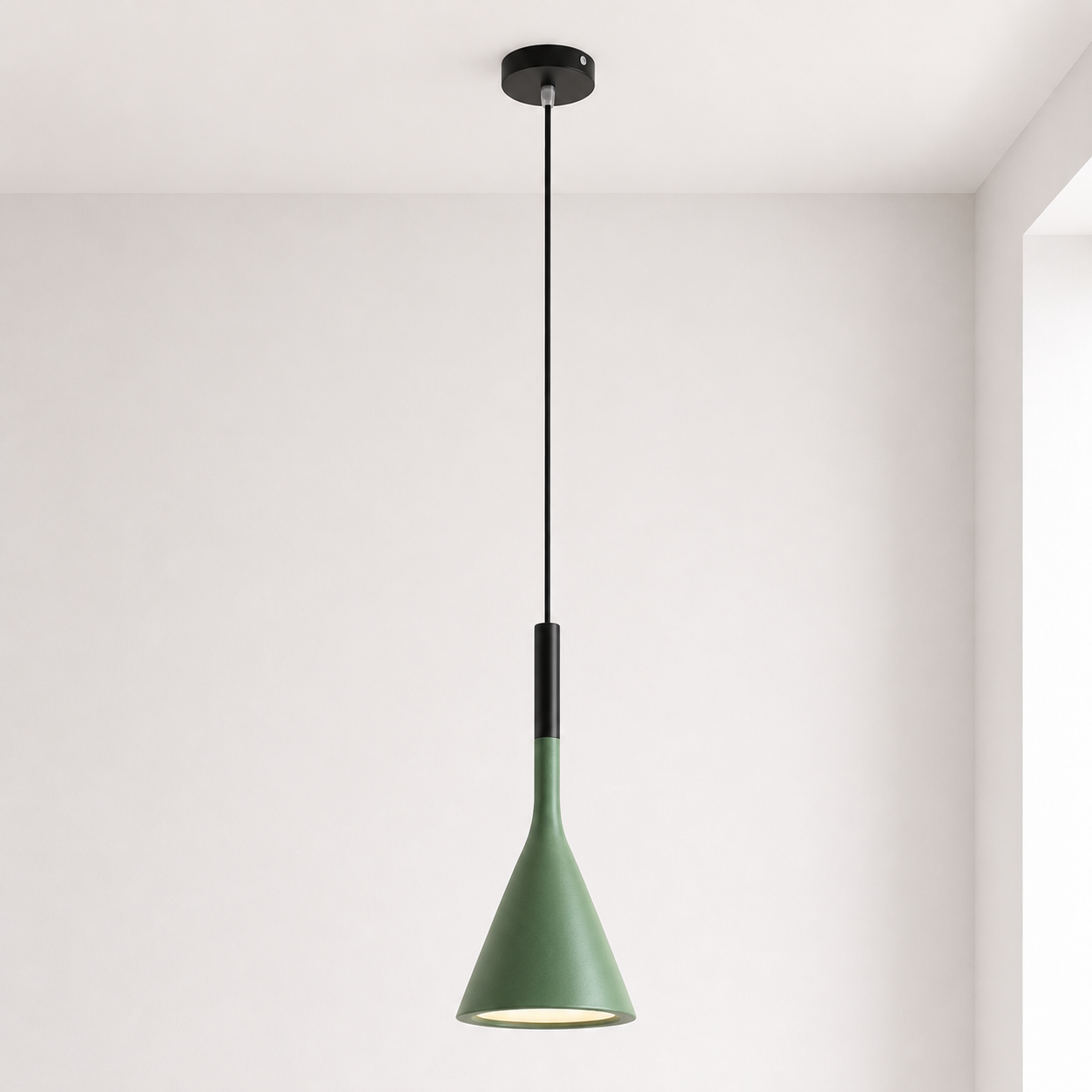 Green pendant light hanging against a white wall