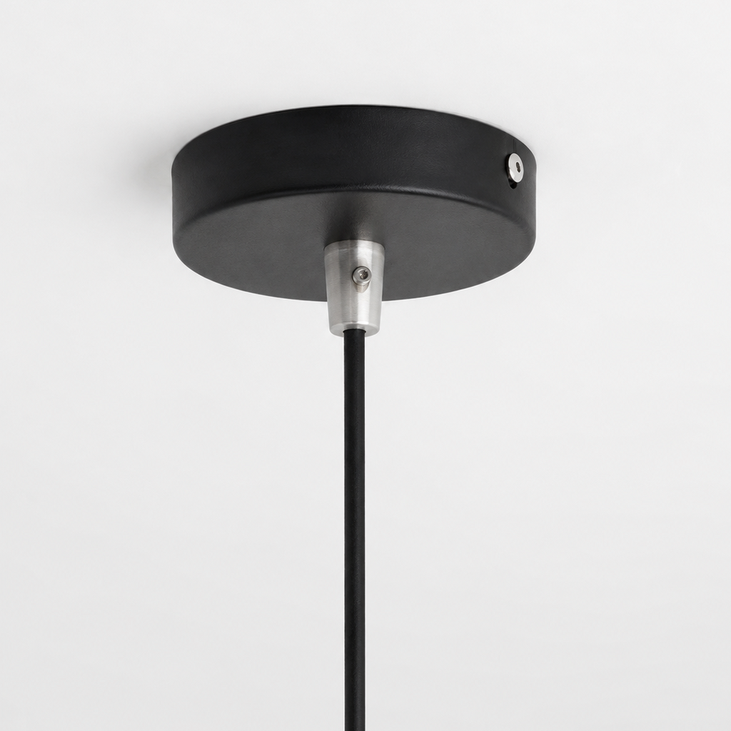 Black pendant light fixture on a white background
