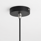 Black pendant light fixture on a white background