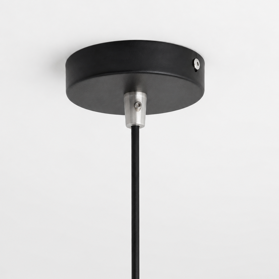 Black pendant light fixture on a white background