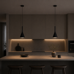 Modern kitchen with pendant lights and a dark ambiance
