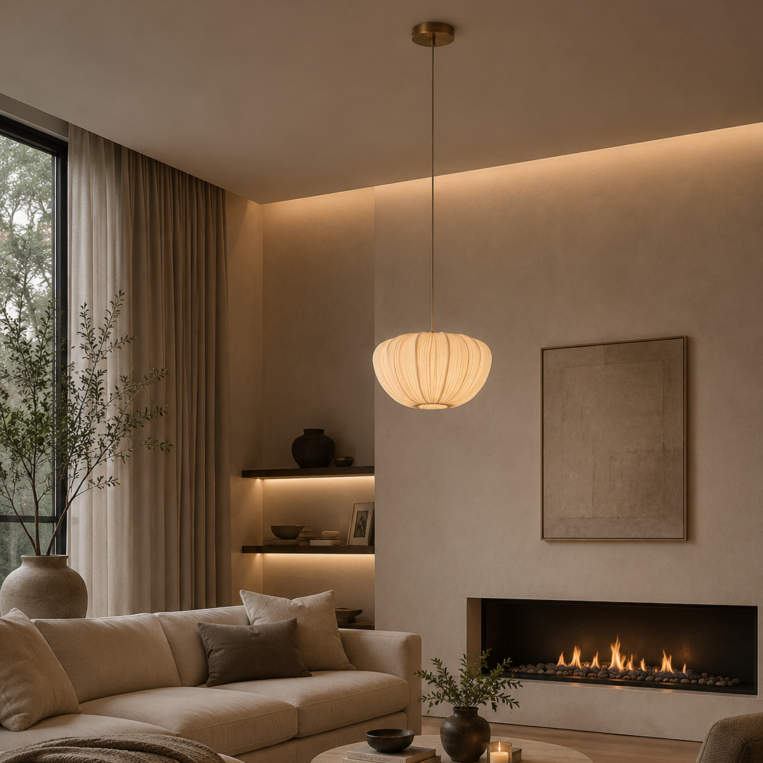Modern living room with a fireplace, sofa, and pendant light.