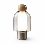 Modern table lamp with a glass shade and wooden top on a white background