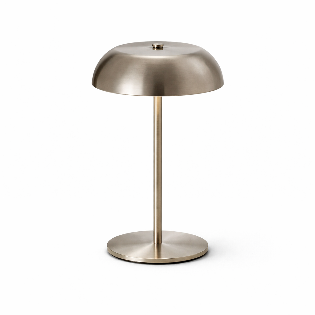 Modern table lamp with metallic finish on a white background