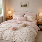 Bedroom with floral bedding and pink pillows