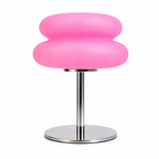 Pink stool with a metallic base on a white background