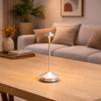 Table lamp on a wooden table in a cozy living room setting