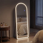 Modern standing mirror with LED lighting in a bedroom setting