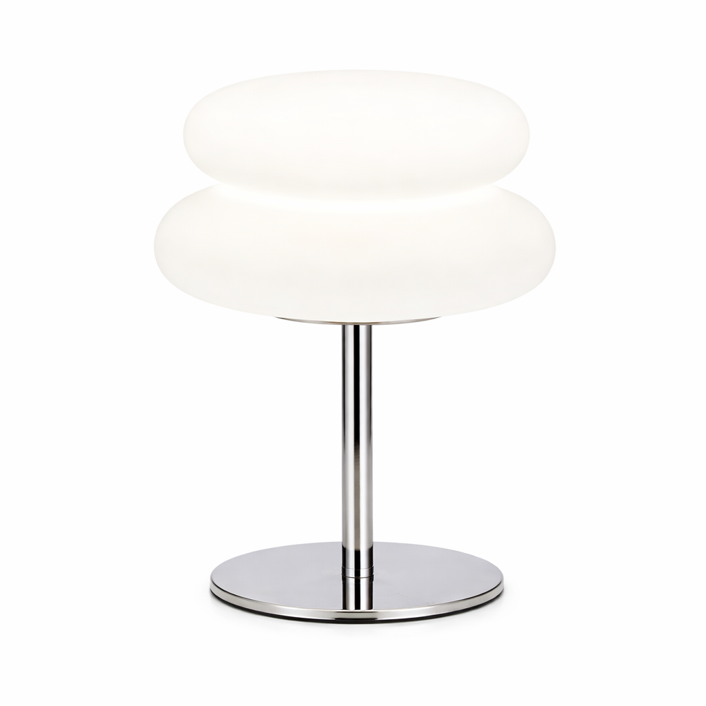 Modern table lamp with white shade and chrome base on a white background